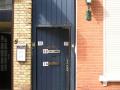 Ingang (aan de achterkant) bovenwoning
